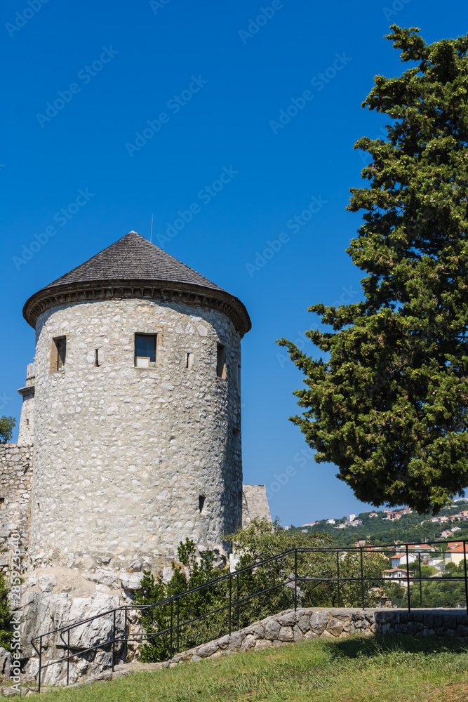 Trsat castle tower view in Rijeka, Croatia, beautiful castle surrounded by trees on summer day, ancient Illyrian and Roman fortress - Image