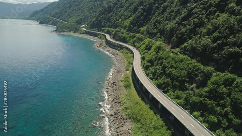 Aerial view of Patapat viaduct in the coast of Pagudpud, Ilocos Norte. Highway with bridge by coast sea near the mountains. Philippines, Luzon. photo