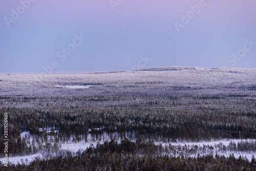 The landscape forest has covered with heavy snow and sunset sky from top view landscape in winter season at Lapland  Finland.