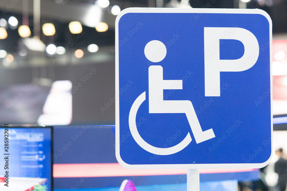 disabled parking or Wheelchair parking sign In the parking lot of the