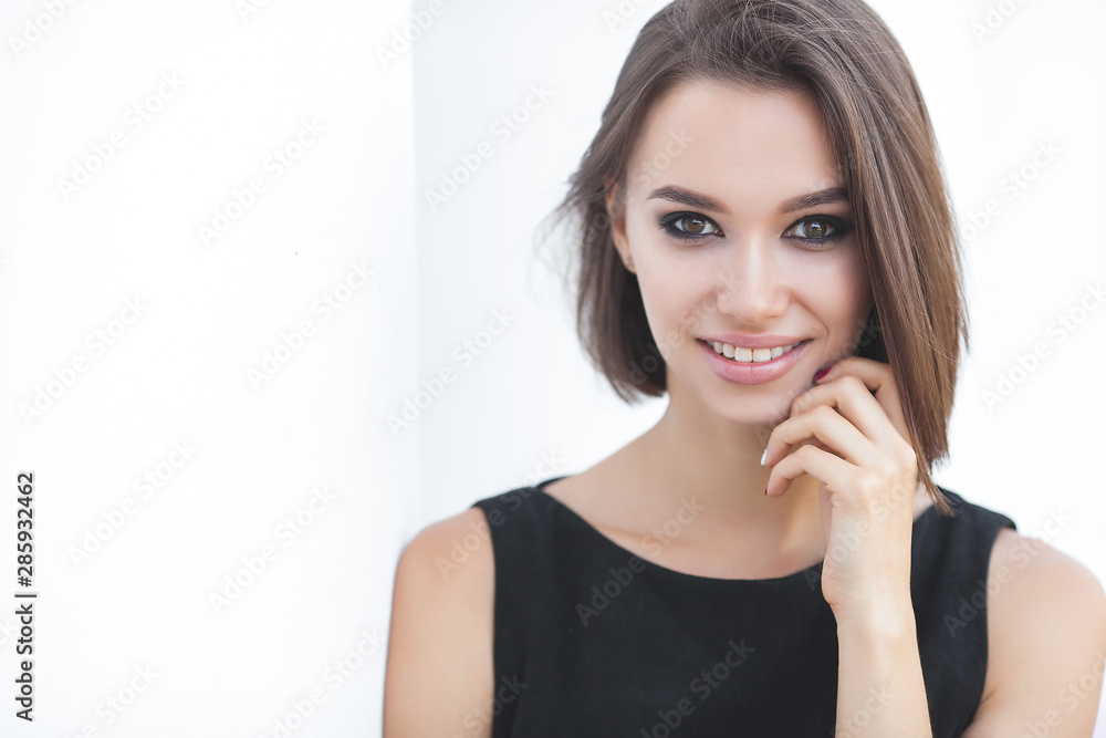 Beautiful elegant woman outdoors. Lady in black dress. Young female classic portrait. Beautiful elegant woman outdoors. Lady in black dress. Young female classic portrait.