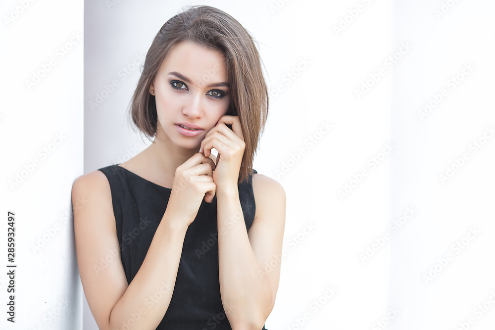 Beautiful elegant woman outdoors. Lady in black dress. Young female classic portrait. Beautiful elegant woman outdoors. Lady in black dress. Young female classic portrait.