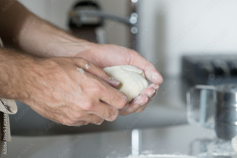 Food, dough for pizza, male hands,  flour , rolling pin