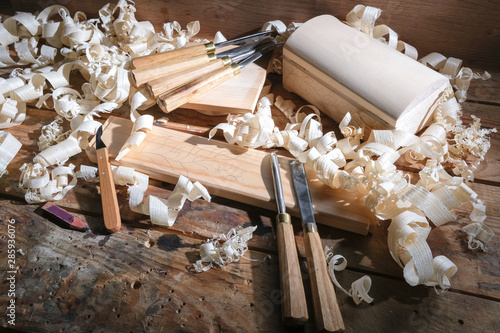 Carpentry tools for wood processing, shavings on a wooden table. photo