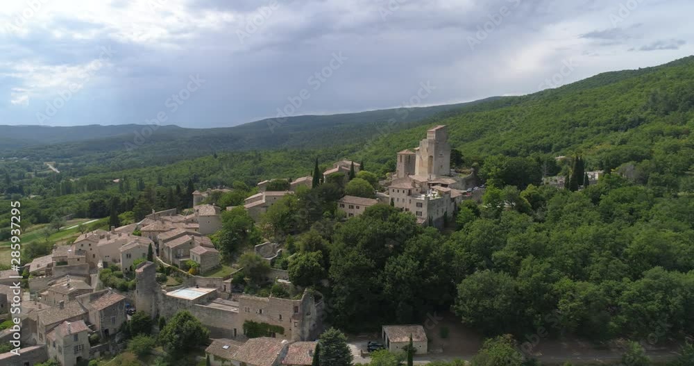 Poët-Laval village, aerial lateral traveling, Drôme, labelled Les Plus Beaux Villages de France. Poët-Laval village, aerial lateral traveling, Drôme, labelled Les Plus Beaux Villages de France.
