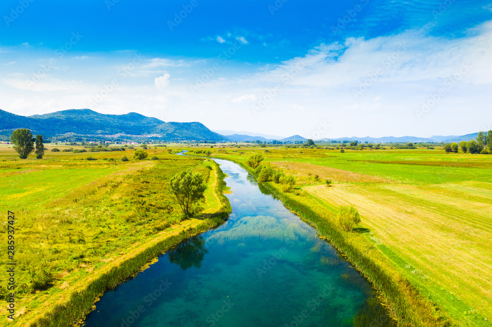 Obraz premium Colorful Gacka valley field and river aerial summer view, Lika region of Croatia
