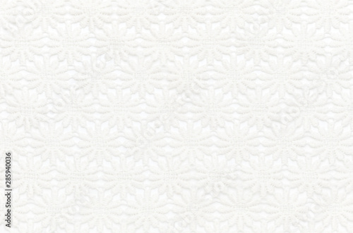 Beautiful white lace on white background. Background image, texture.