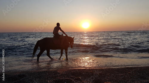 horse ridding in sunset time by the sea preveza greece