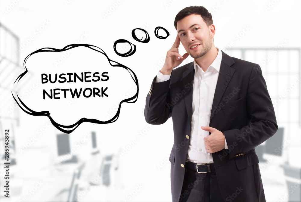 Business, technology, internet and network concept. The young businessman comes up with the keyword: Business network Business, technology, internet and network concept. The young businessman comes up with the keyword: Business network