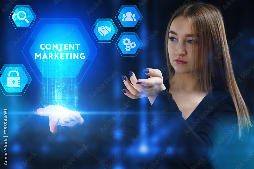 The concept of business, technology, the Internet and the network. A young entrepreneur working on a virtual screen of the future and sees the inscription: Content marketing The concept of business, technology, the Internet and the network. A young entrepreneur working on a virtual screen of the future and sees the inscription: Content marketing