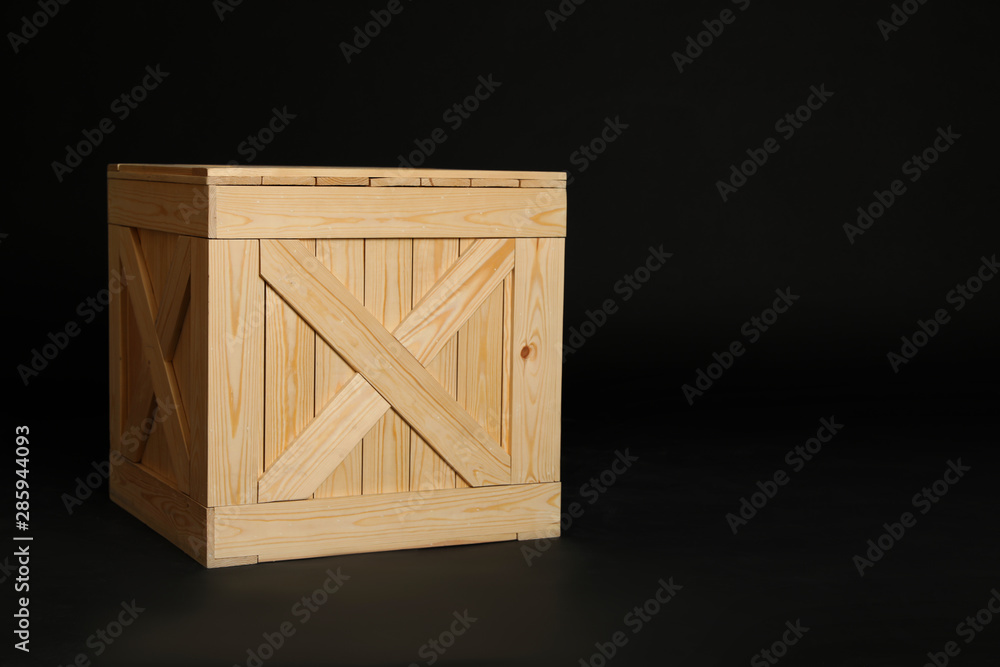 Wooden crate on black background. Space for text Wooden crate on black background. Space for text