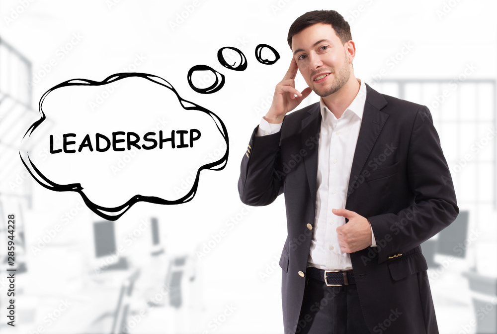 Business, technology, internet and network concept. The young businessman comes up with the keyword: Leadership Business, technology, internet and network concept. The young businessman comes up with the keyword: Leadership