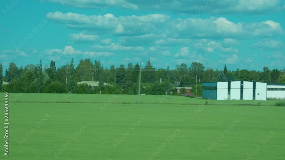 Travel with train in village. Windows seat. View from inside. Houses, trees, forest and fields. Travel with train in village. Windows seat. View from inside. Houses, trees, forest and fields.