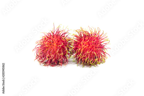Two rambutan fruit isolated on white background.
