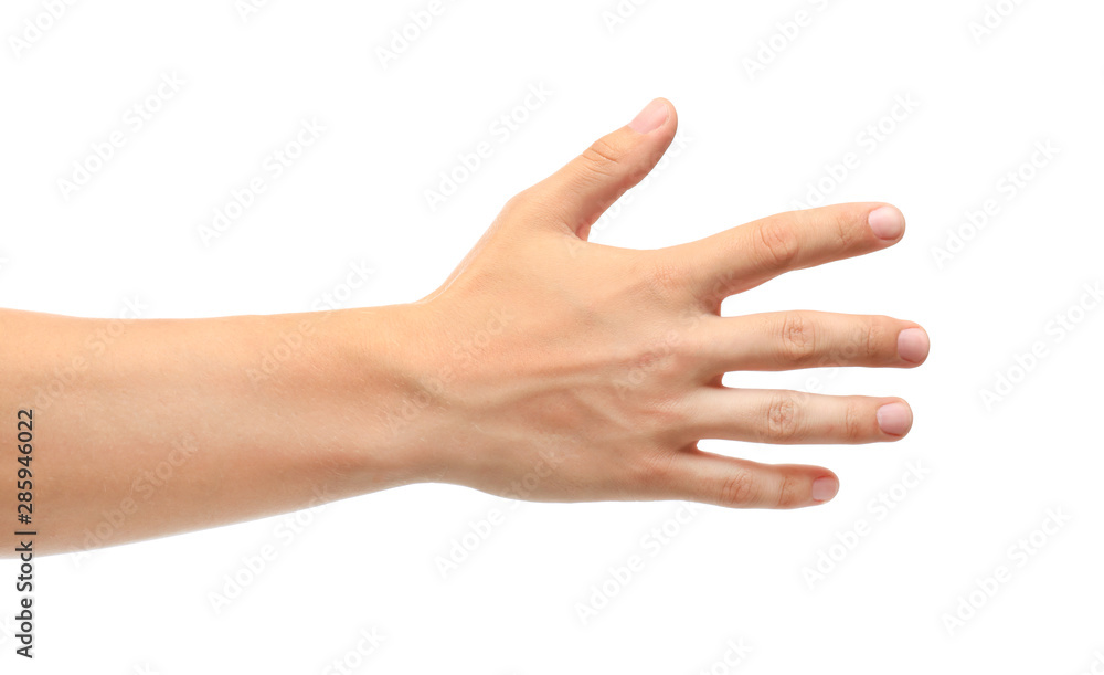 Young man held out hand on white background, closeup