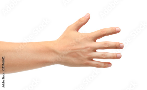 Young man held out hand on white background, closeup