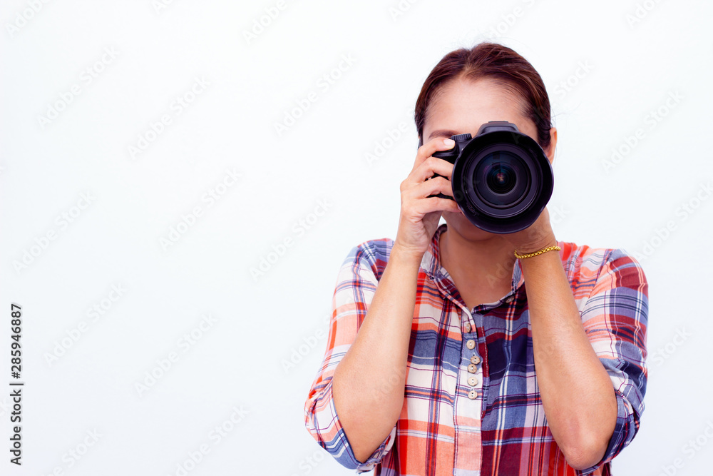 Woman photographer is taking images with dslr camera on white background.Asian woman photographer Woman photographer is taking images with dslr camera on white background.Asian woman photographer
