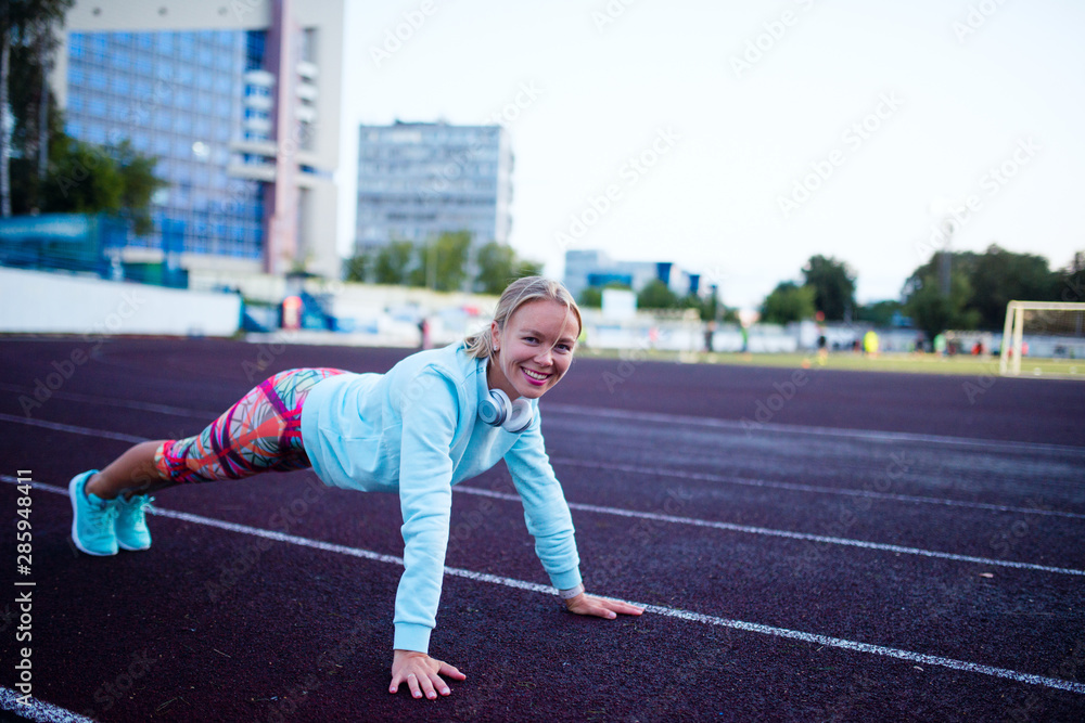 young girl workout at the stadium