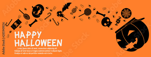 Composition of splashing Halloween candy on orange background