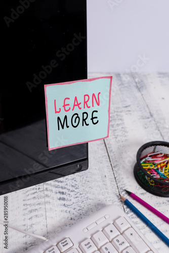 Word writing text Learn More. Business photo showcasing knowledge or skill acquired by instruction Considerable learning Note paper taped to black computer screen near keyboard and stationary photo