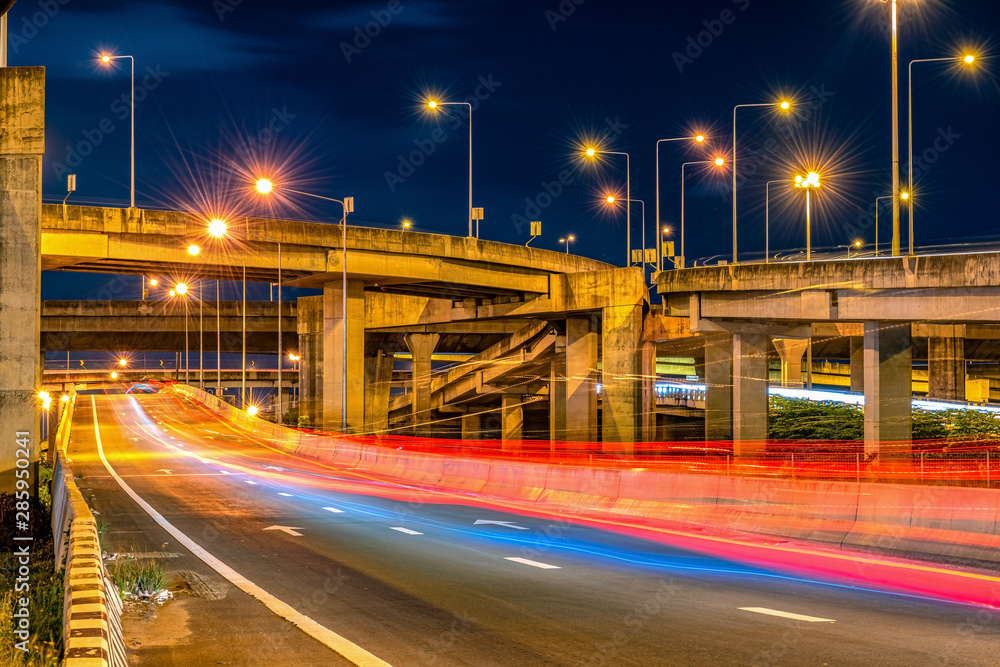 Underside of an elevated roads Expressway bridge and traffic at night