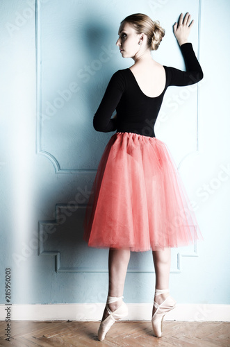 Young caucasian woman in tutu and pointe portrait
