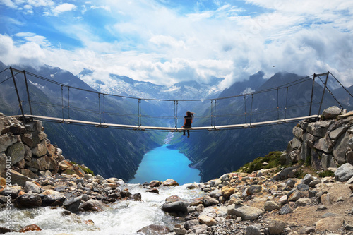Hiking the Zillertal Alps from Schlegeisspeicher (water reservoir) to Olperer Hütte and famous instagram swing bridge photo