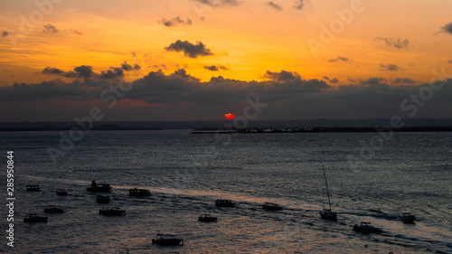 Sunset at Morro de São Paulo Bahia pier and boats
