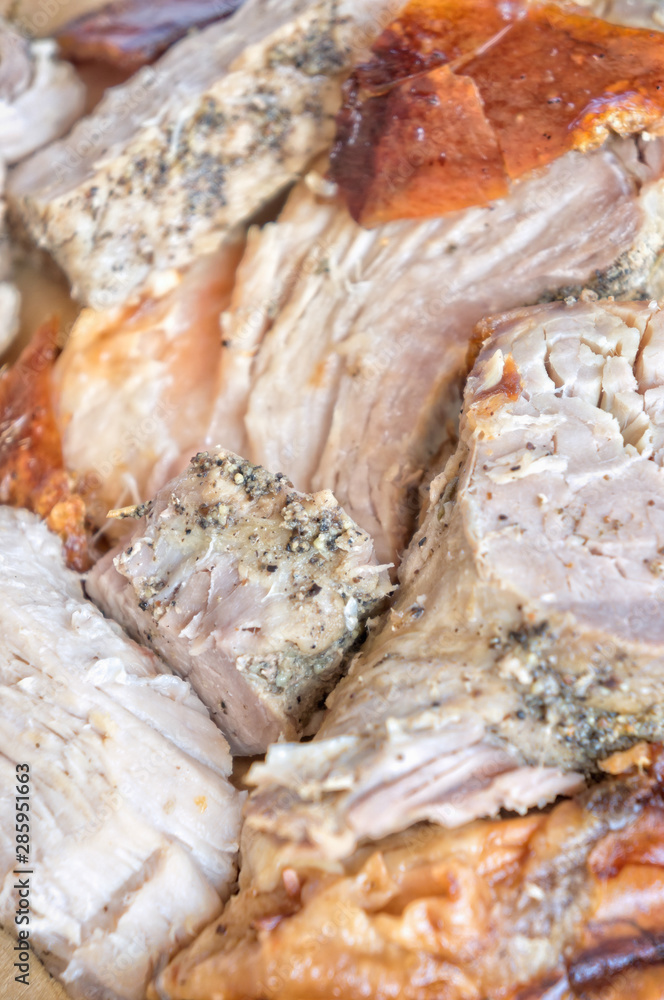 Porchetta - italian roasted pork on wooden cupboard Porchetta - italian roasted pork on wooden cupboard