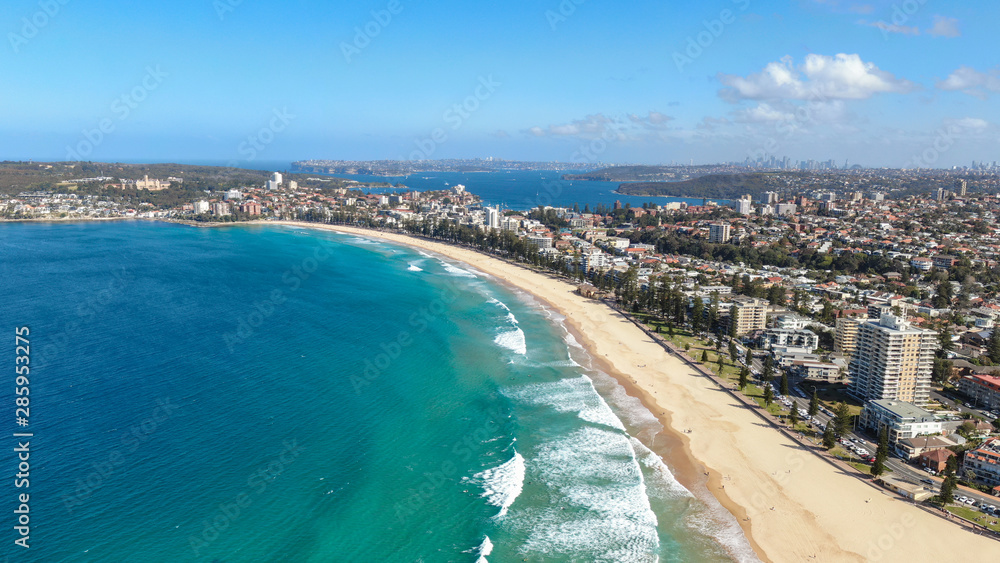 Panoramic high angle drone view of Manly Beach and the Sydney Harbour area. Manly is a popular suburb of Sydney, New South Wales, Australia. Famous tourist destination, easy to reach by ferry from CBD