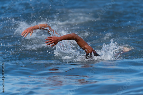 Athletes swimming in a competition swimming at triathlon © pavel1964