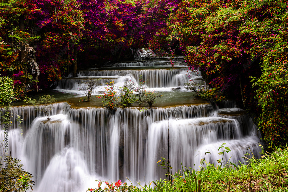 amazing of huay mae kamin waterfall in colorful autumn forest at Kanchanaburi, thailand