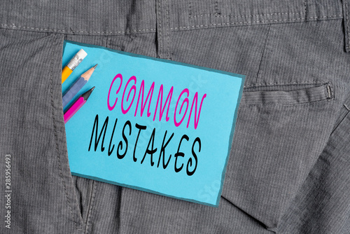 Conceptual hand writing showing Common Mistakes. Concept meaning actions that are often used interchangeably with error Writing equipment and blue note paper in pocket of trousers