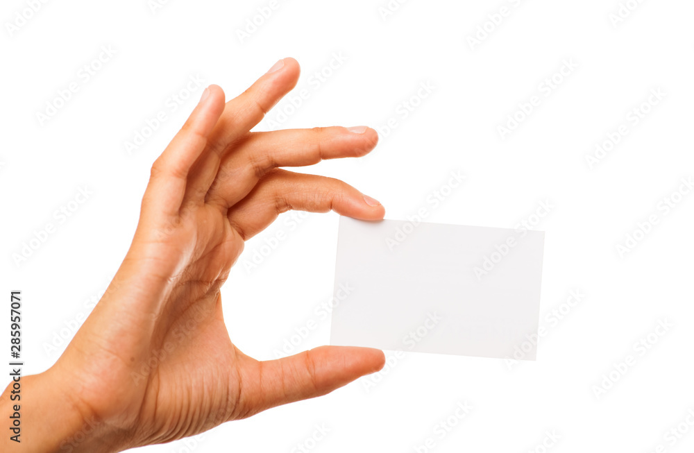 Obraz premium Empty sheet of paper in female hand solated on white