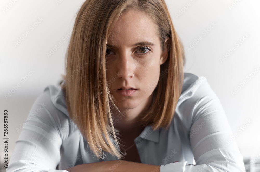 Blonde girl photographed inside a house. Blonde girl photographed inside a house.