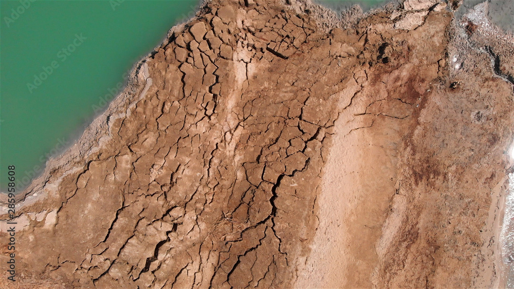 Fototapeta premium Sinkholes With water in dead sea aerial view 