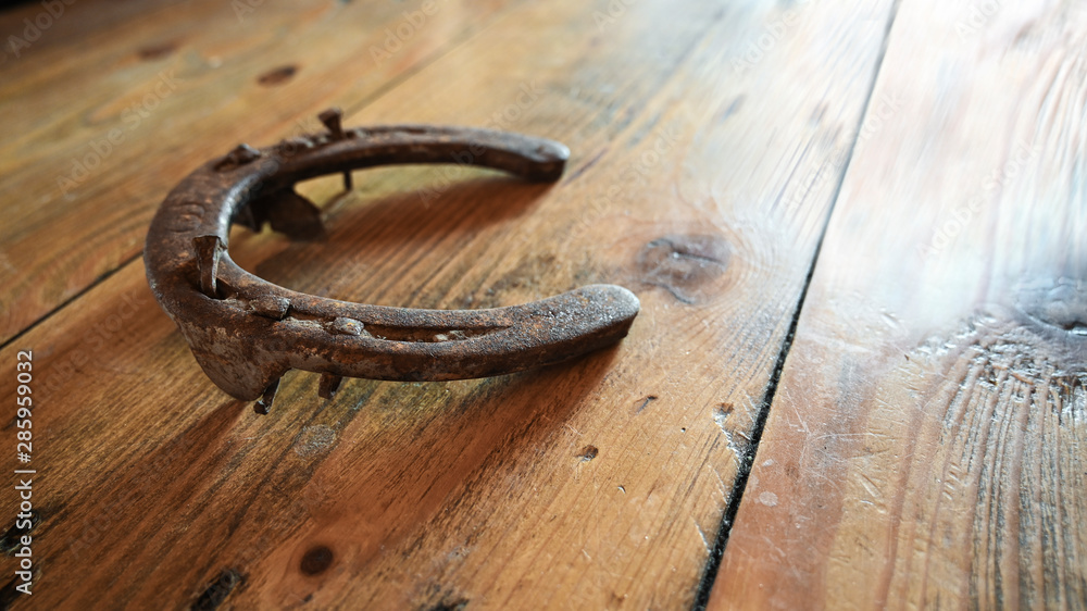 Old rusty horseshoe on the wall Old rusty horseshoe on the wall