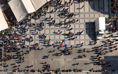  Panoramic top view of walking tourists on the Old Town Square, Prague. Picture taken from the Clock Tower