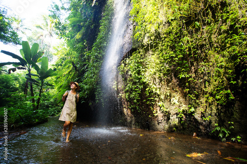 Woman near waterfal on Bali  Indonesia  