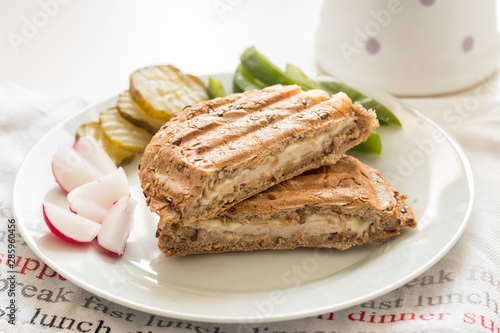 Healthy whole wheat toast sandwich with vegetables and tea