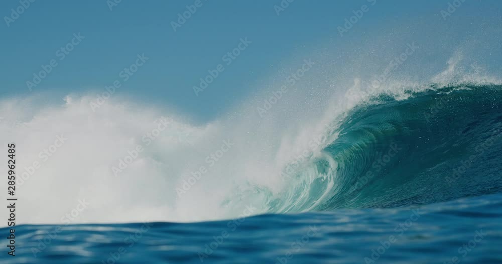 Ocean wave breaking and barreling with spray Ocean wave breaking and barreling with spray