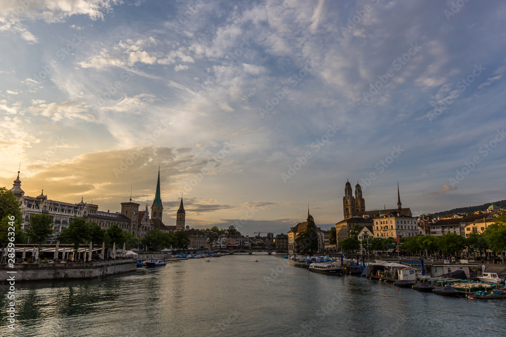 Historic Zurich downtown skyline with Fraumunster and Grossmunster churches at lake zurich during sunset, Switzerland