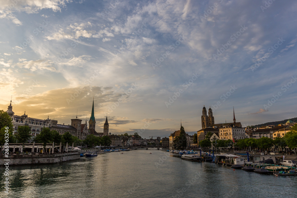 Historic Zurich downtown skyline with Fraumunster and Grossmunster churches at lake zurich during sunset, Switzerland Historic Zurich downtown skyline with Fraumunster and Grossmunster churches at lake zurich during sunset, Switzerland