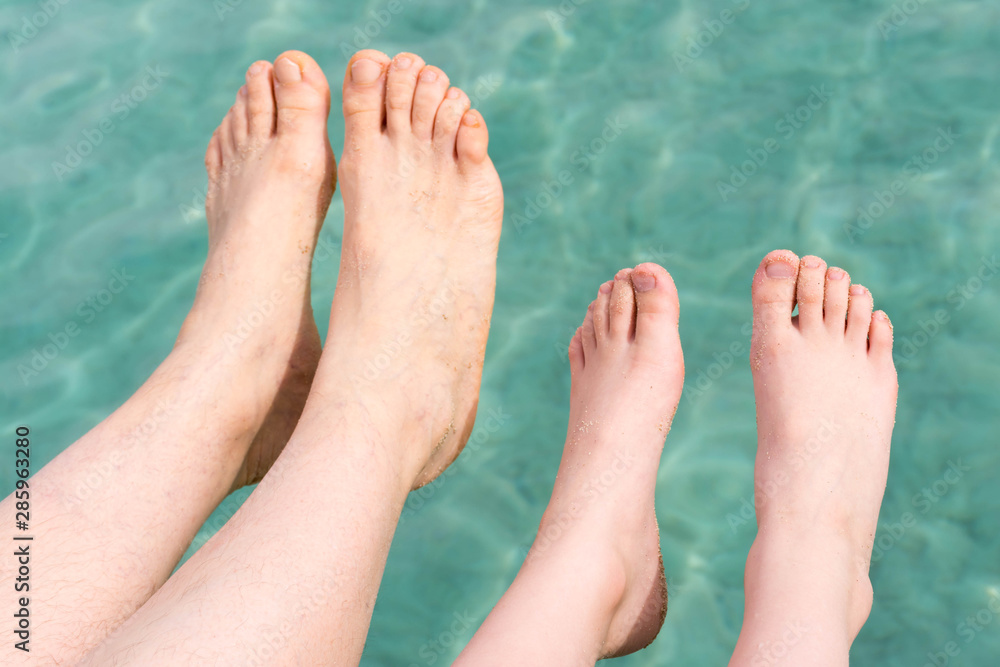 adult and child feet above sea surface adult and child feet above sea surface