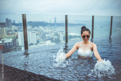 Asian girl in a white bikin...