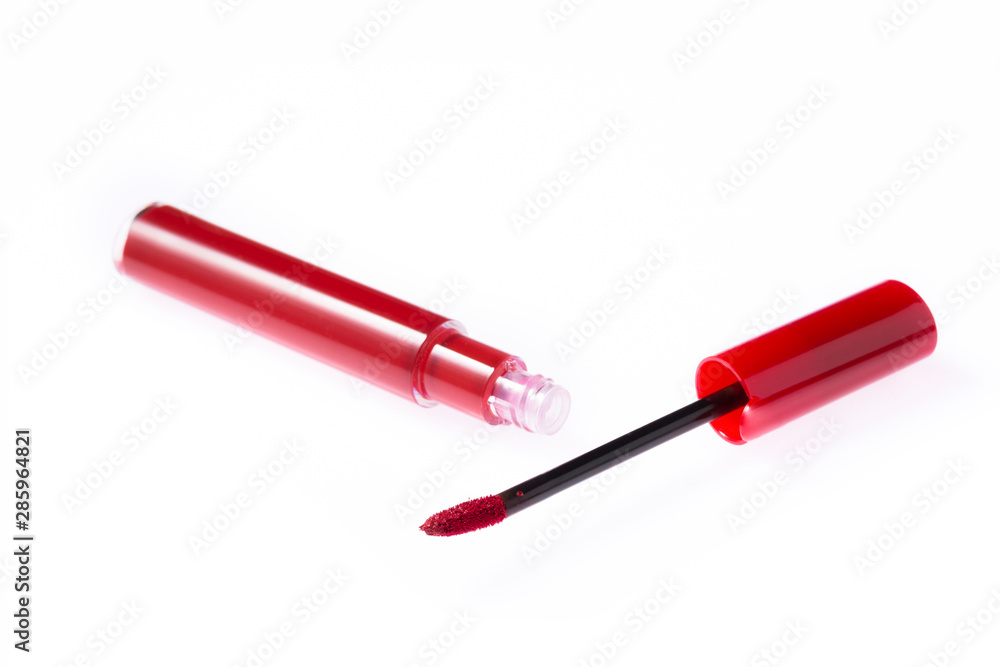 Red color lip gloss brush on background Red color lip gloss brush on background