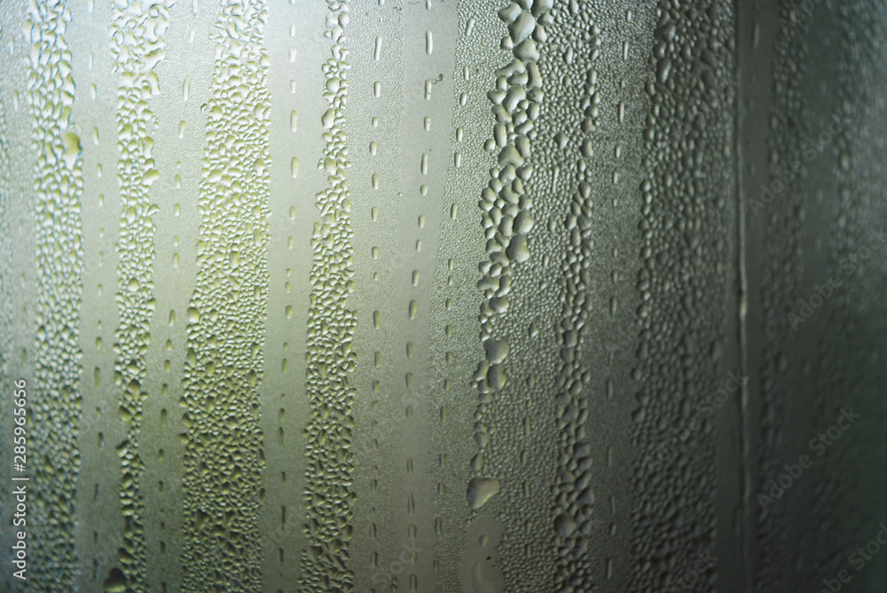 Transparent glass steamed with steam, condensation of water and small ...