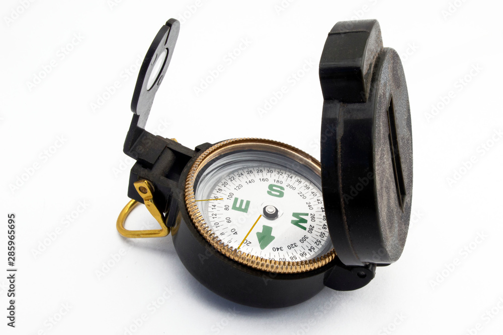 Magnetic compass for tourists on a white background. Magnetic compass for tourists on a white background.