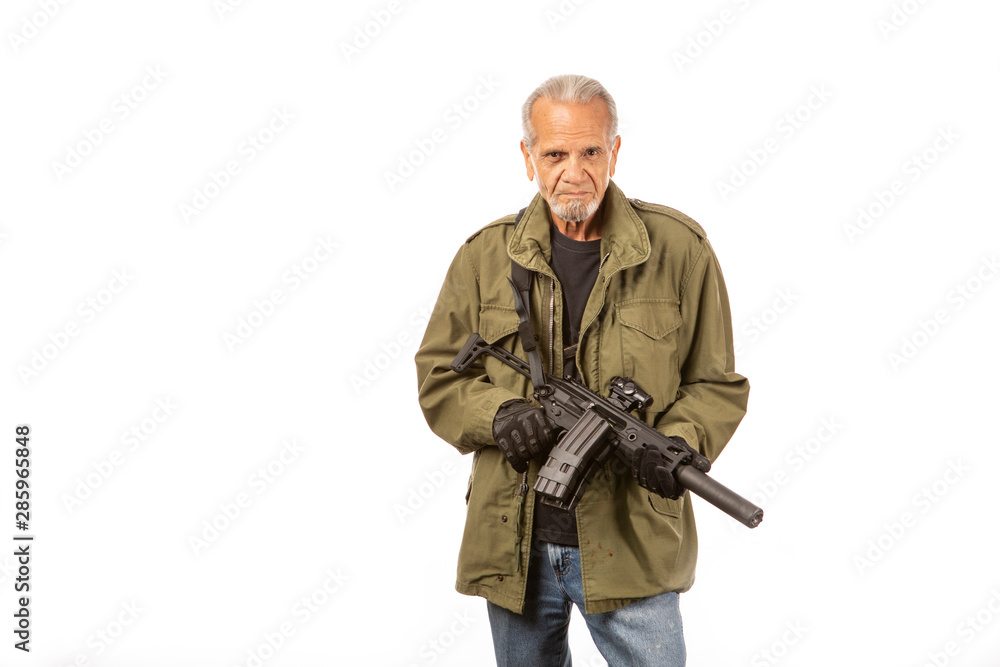 Apocalypse doomsday prepper with AR 15 rifle, wearing field jacket on white background.