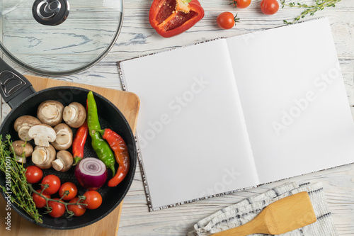 Canvastavla Recipe book with copy space for text, overhead composition with fresh organic in